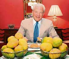 US Ambassador David C. Mulford enjoys an Indian mango in New Delhi on Thursday. President Bush’s pledge to open US market to Indian mangoes is an important step in increasing agricultural trade between the USA and India.