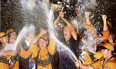 Members of the Australia team, including captain Ricky Ponting (centre left) and coach John Buchanan (centre with trophy), celebrate their victory over Sri Lanka in the World Cup cricket final in Bridgetown.