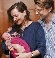 Delighted parents, British nationals Charlotte Walter and Jonathan Walter, watch their little Water Baby make a face at a press conference in Delhi on Wednesday. Charlotte delivered the baby using the water birth technique, without the use of any painkillers and other drugs required in the conventional methods at a hospital in Delhi.