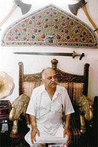 Ravi Bhasin sits on a 250-yr-old maharaja’s chair