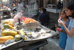 Vendors sell cutfruits in the Hall bazaar market despite a ban imposed by the administration