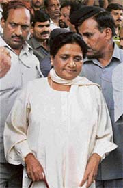 BSP supremo Mayawati comes out after handing over a letter staking claim to form the government in Uttar Pradesh to state Governor T.V. Rajeshwar at Raj Bhavan in Lucknow