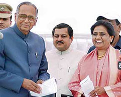 UP Governor TV Rajeshwar with BSP supremo Mayawati after she took oath as Chief Minister of the state at Raj Bhavan in Lucknow on Sunday.