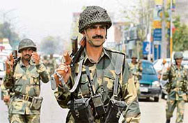 BSF jawans on flag march in Amritsar on Friday.