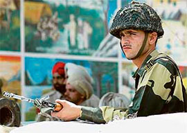 A BSF jawan keeps vigil at Dera Sacha Sauda, in Salabatpura on Monday.