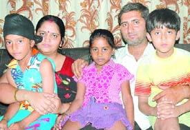 Amarpratap, who has been rechristened Sanchit, with his new family after the court gave his custody to his biological parents.