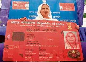 Mishro Shankar Lal shows the replica of the Multipurpose National Identity Card (MNIC), issued to her in Delhi on Saturday. Mishro is the first Indian to get the card