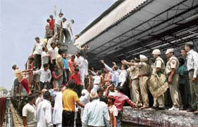 Members of the Gujjar community block the railway track during a demonstration in support of their demand for reservation in Meerut