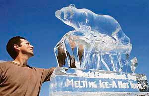 An ice sculpture of a polar bear is unveiled in central London to mark World Environment Day.