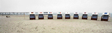 A man relaxes next to beach chairs with the flags of Europe and the G8 countries on the beach of Kuehlungsborn, northeastern Germany. The G8 summit will bring together the leaders of Britain, Canada, France, Germany, Italy, Japan, Russia and the United States during the summit.