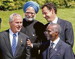 Prime Minister Manmohan Singh, US President George W. Bush, French President Nicolas Sarkozy and South African President Thabo Mbeki share a light moment while posing for a photo at the G-8 Summit in Heiligendamm, Germany, on Friday.