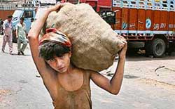 Another day of toil for this boy in New Delhi on World Day against Child Labour on Tuesday. 