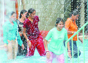 Women take a chill pill at an amusement park in Jalandhar on Tuesday.