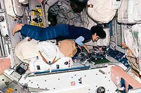 A NASA photo shows astronaut Sunita L. Williams using a computer in the Unity node of the international space station