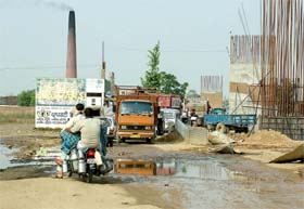 Commuters have a tough time commuting on the Jalandhar- Jandusingha road near railway crossing as a ROB construction company has covered almost full width of road without laying any diversion passage in Jalandhar