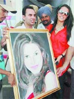 Bollywood actor Neha Dhupia with her portrait in Amritsar