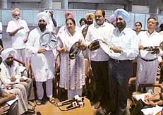 Rajinder Kaur Bhattal with her music band in the lobby of the Punjab Vidhan Sabha.