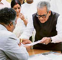 Independent Presidential candidate Bhairon Singh Shekhawat hands over the nomination papers to Lok Sabha Secretary-General P.D.T. Achary (left) at Parliament House in New Delhi on Monday