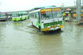 A drizzle on Tuesday was enough to make the local bus stand a huge pool of water