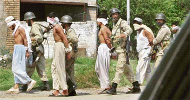 Pakistani soldiers escort detained militants who were holed up in Lal Masjid in Islamabad