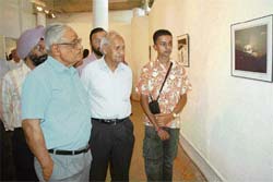 ( L to R) The Tribune Editor-in-Chief H.K. Dua, Rock Garden creator Nek Chand and the artist, Asim Singh Halwarvi.