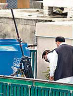 A long-barrelled anti-aircraft gun on the rooftop of a house in the garrison town of Rawalpindi after reports that President Pervez Musharraf's aircraft was fired upon on Friday.
