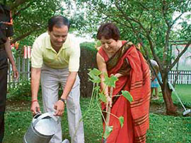 Brig S.K. Thapa and his wife plant a sapling to mark Mission Greening India at the Military Station Environment Park, Pathankot