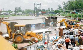 A demolition drive in progress on the G.T. Road near Ambala Cantt