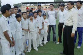 Budding cricketers get tips from AGA general secretary Mohit Khanna in Amritsar on Tuesday.