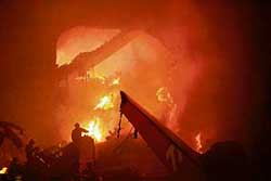 A building burns after a Brazilian passenger plane crashed at Sao Paulo airport. 