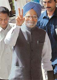 Prime Minister Dr Manmohan Singh shows the victory sign to mediapersons after casting his vote for the Presidential election at Parliament House in New Delhi