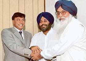 Lakshmi N. Mittal with Punjab CM Parkash Singh Badal and Sukhbir Badal in New Delhi