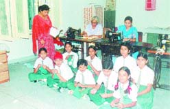 Students of Khosla Deaf School learn stitching skills.