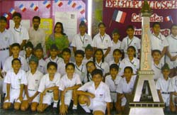 Students of Delhi Public School pose with a model of Eiffel Tower during a summer camp.