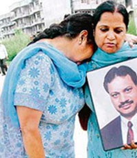 Surender Kaur (left) and Anuradha Bali, widows of two blast victims, outside the Burail Jail in Chandigarh