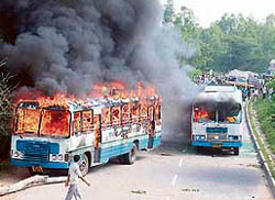 Buses of Haryana Roadways burnt by a mob at Manesar after seven Kanwarias were killed in road accidents.