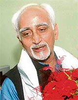 Hamid Ansari with flowers after being elected in New Delhi on Friday.