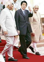 Japanese Prime Minister Shinzo Abe with Vice-President Hamid Ansari and Lok Sabha Speaker Somnath Chatterjee at Parliament House in New Delhi on Wednesday.