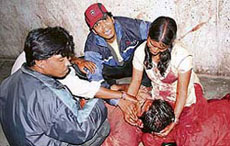 Relatives weep near a person injured in the blast at Lumbini Park in Hyderabad on Saturday.