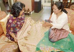 Designer Kavita Gautam shows off her creations at a client's home.