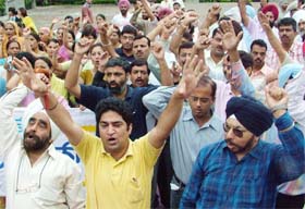 Members of the Punjab and Chandigarh College Teachers Union protest in Jalandhar
