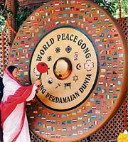 President Pratibha Patil beats the 'World Peace Gong', during the launch of a special exhibition, 'India 's March to freedom from: 1857 to 1947 - Kranti to Gandhi, Raj to Swaraj' at Gandhi Smriti and Darshan Samiti, in New Delhi