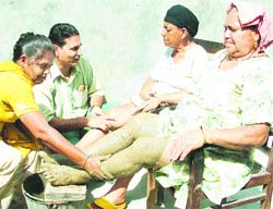 A woman takes naturopathy treatment at Sarvodhya Bhavan in Jalandhar on Tuesday.
