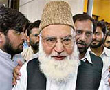 Qazi Hussain Ahmed, chief of a coalition of hard-line Pakistani religious parties, leaves after a hearing of his petition at the Supreme Court in Islamabad on Monday.