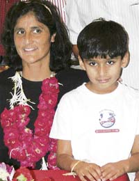 US astronaut Sunita Williams poses with her nephew Parth Pandya upon her arrival at a hotel in Ahmedabad