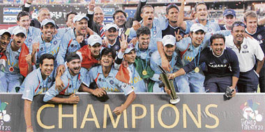 Men in Blue with the trophy.