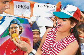 Cricket fans celebrate Team Indias victory over Pakistan in Twenty20 with sweets in Bikaner on Tuesday.