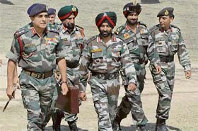 Army Chief Gen Deepak Kapoor (L) arrives with other officers during his visit to the Beerwah Army base, 38 km from Srinagar