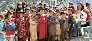 Innocent survivors of 2005 earthquake with their school teacher.