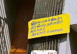 This board outside Shingar cinema in Ludhiana seemed to have been of no use as pieces of bags and suticases were found strewn around in the blast site.